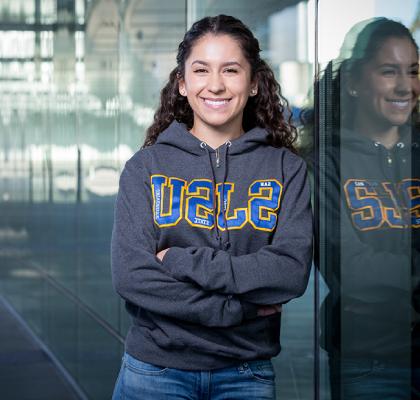 Smiling female 菠菜网lol正规平台 student in sweatshirt